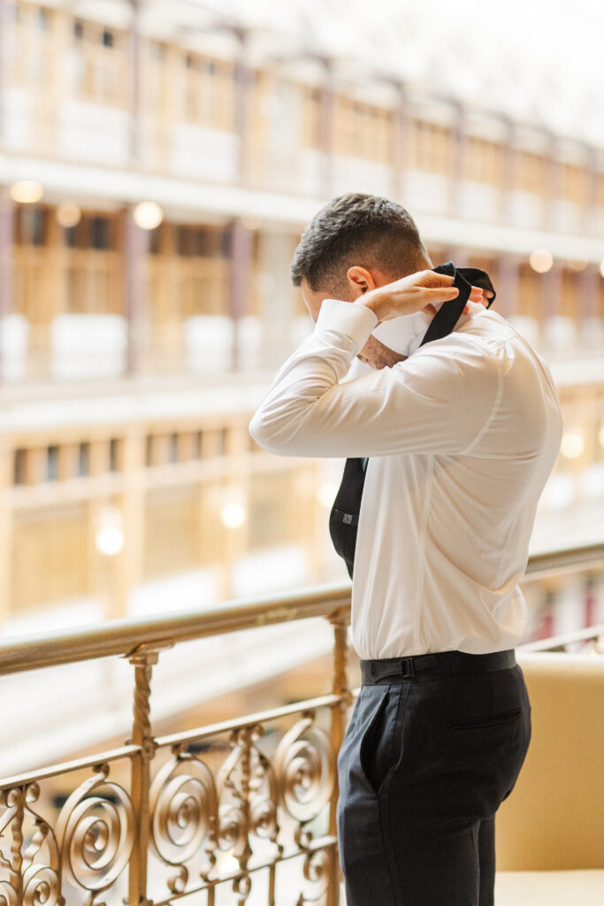 Groom and groomsmen getting ready at the Hyatt at the Arcade before a Cleveland wedding