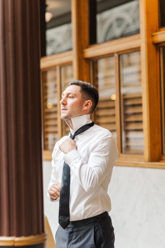 Groom and groomsmen getting ready at the Hyatt at the Arcade before a Cleveland wedding