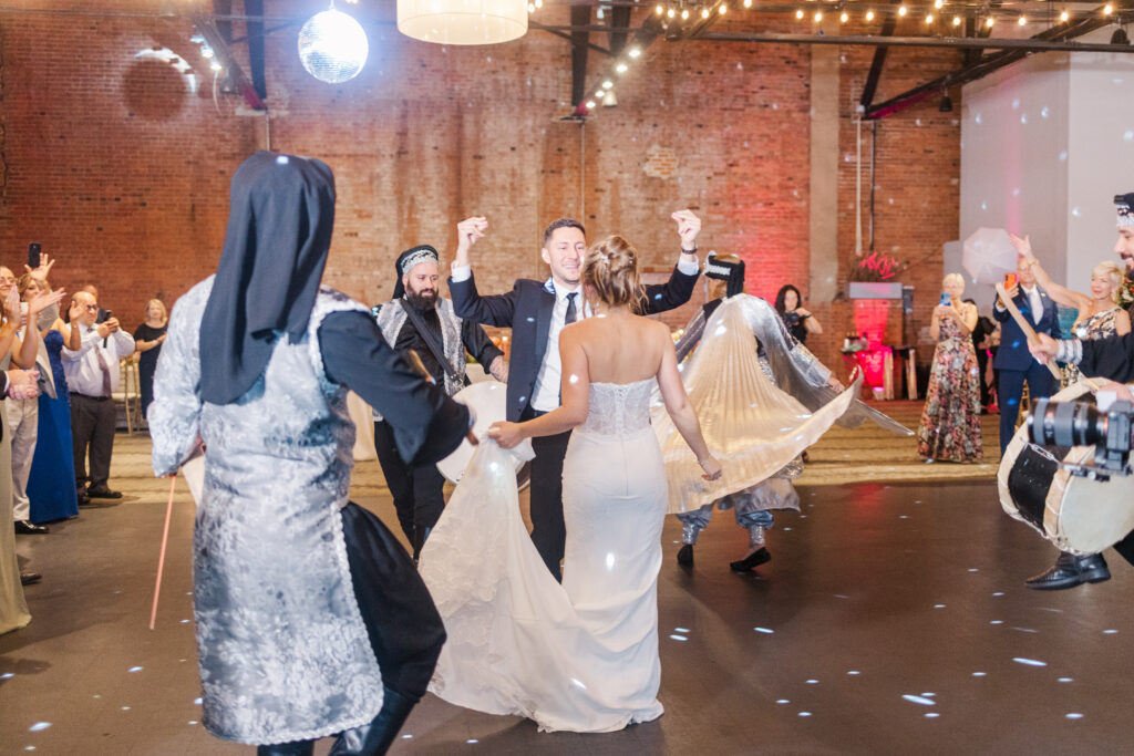 Bride and groom dancing during their Windows on the River reception